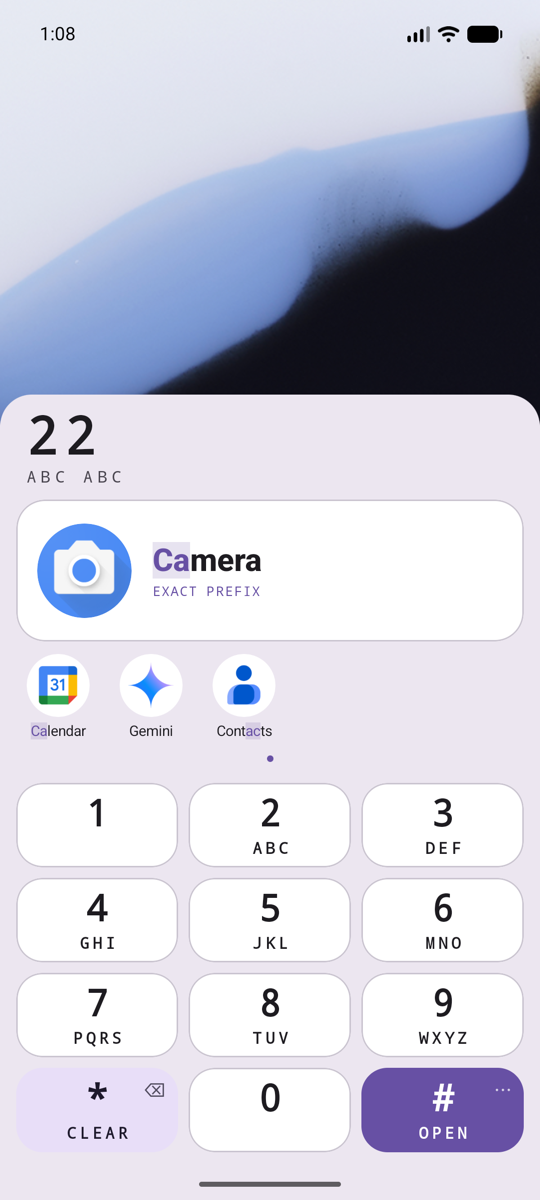 The keypad with 2 2 typed. The first app found is Camera, with three more apps beside it.